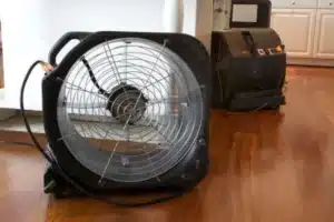 large fans drying out a home after flooding